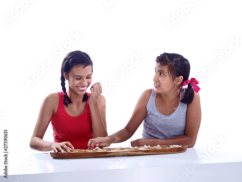 girls playing mancala photo