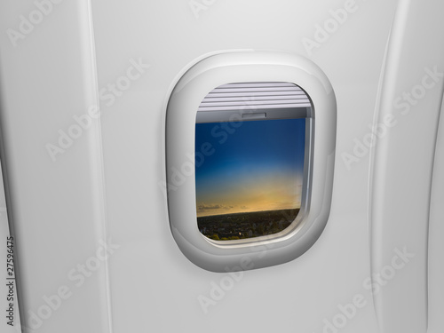 Window airplane view on sunset
