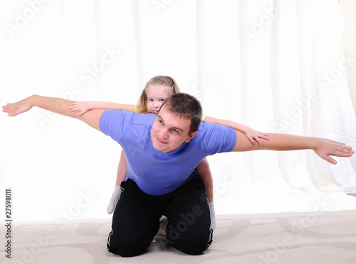 young father has fun with his daughter