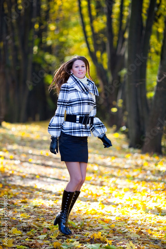 Beautiful girl jumping in a park © Zzvet