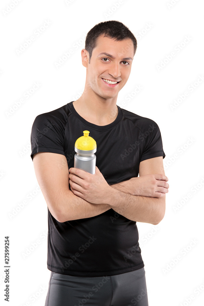 Athlete man posing with a plastic bottle in his hand Athlete man posing with a plastic bottle in his hand