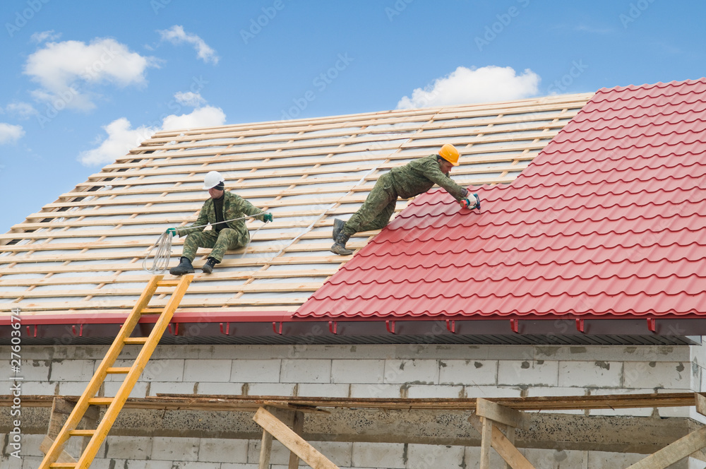 Naklejka premium roofing work with metal tile
