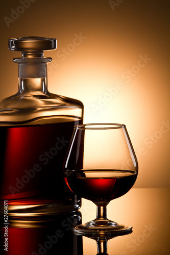 Still life with cognac glass and bottle in box