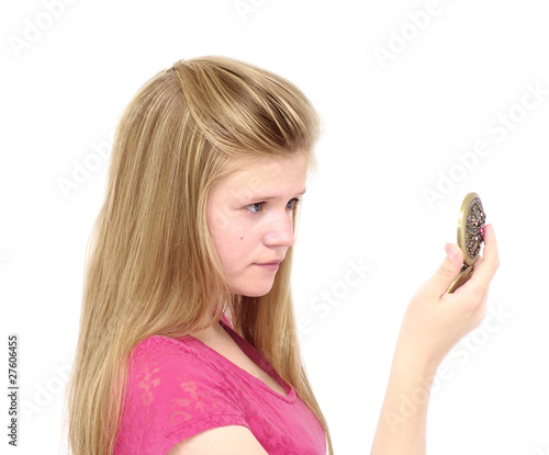 girl looks through  handglass photo