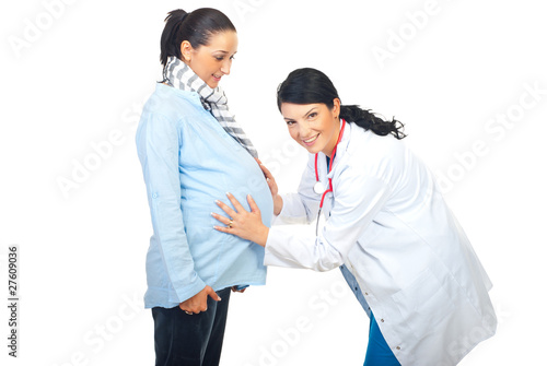 Cheerful doctor examine pregnant belly