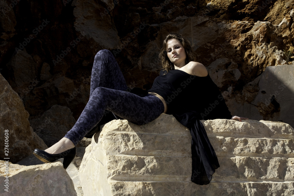 woman poses on a stone quarry woman poses on a stone quarry