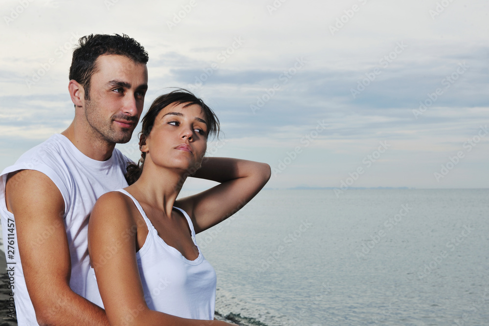 happy young couple have fun at beautiful beach happy young couple have fun at beautiful beach