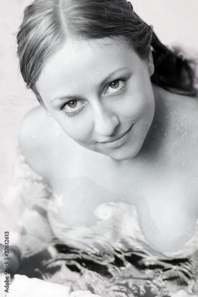 portrait of a beautiful happy woman in swimming pool