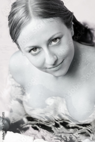 Fototapeta Naklejka Na Ścianę i Meble -  portrait of a beautiful happy woman in swimming pool