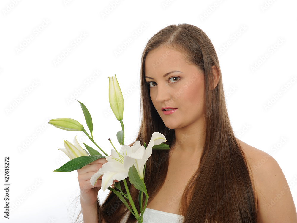 Beautiful woman in bath towel with long healthy hair and flower Beautiful woman in bath towel with long healthy hair and flower