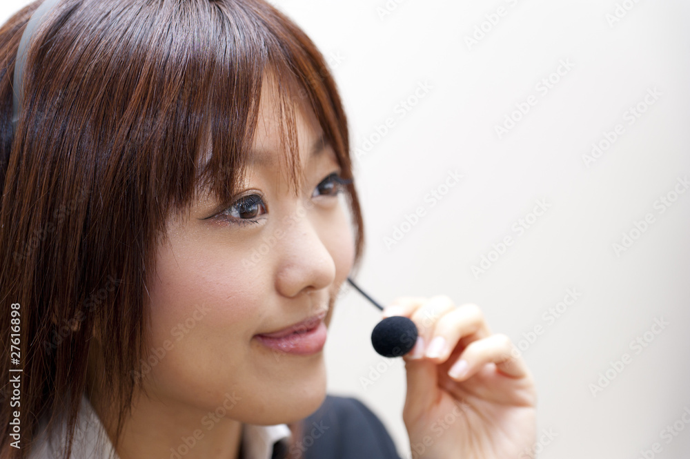 a portrait of young business woman with haedset a portrait of young business woman with haedset