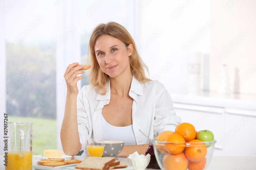 Woman having breakfast in the morning Woman having breakfast in the morning