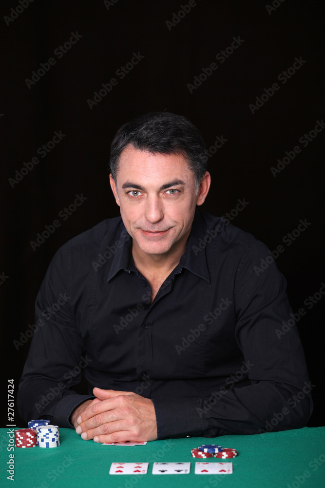 Man sitting at poker table Man sitting at poker table