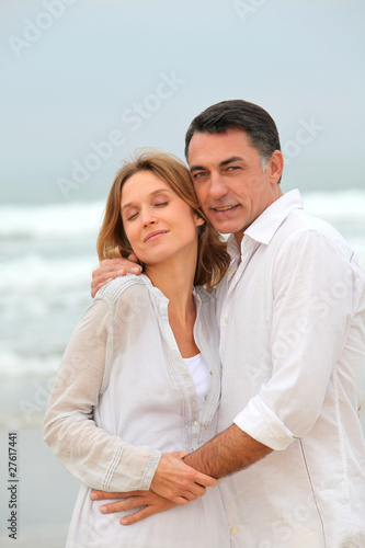 Couple walking by the beach