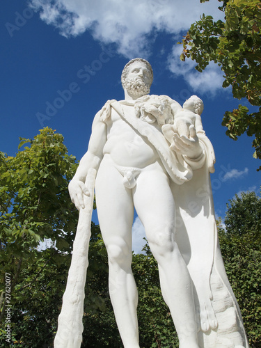 A man hold a baby statue with club