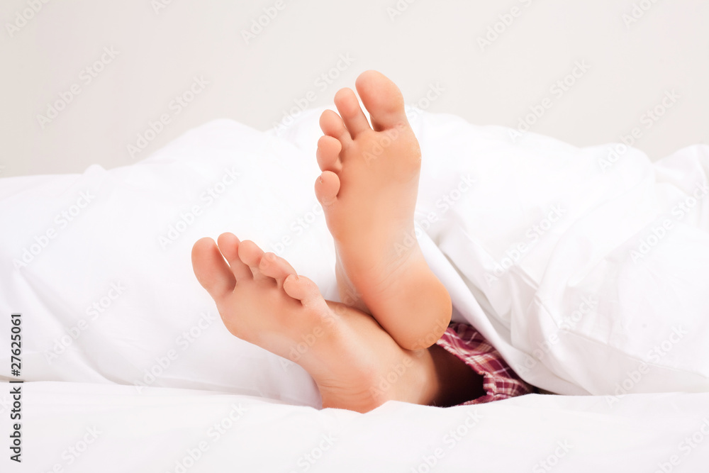 feet of a sleeping woman feet of a sleeping woman