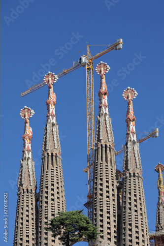 Cranes around unfinished Sagrada Familia cathedral in Barcelona
