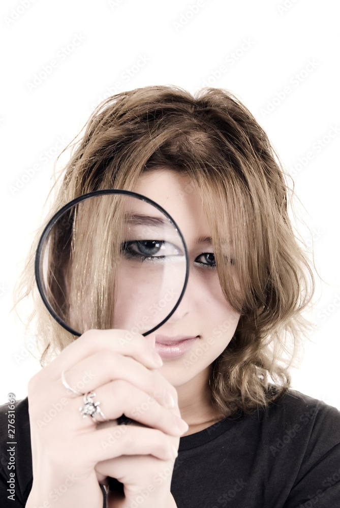 young girl with magnifying glass