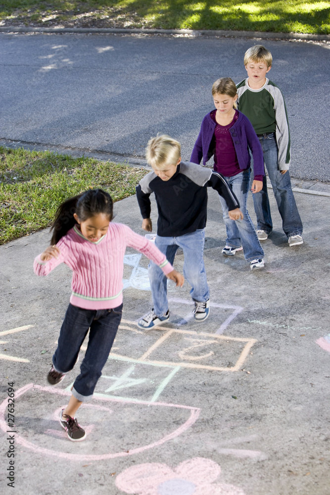 Fototapeta premium Children playing hopscotch