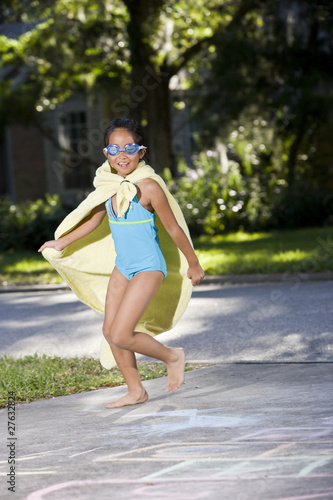 Make-believe, girl in homemade superhero costume © Kablonk Micro