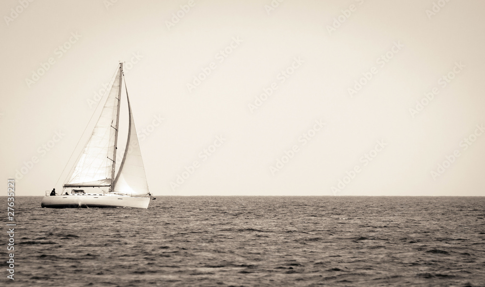 sepia tone picture of yacht sailing on the sea