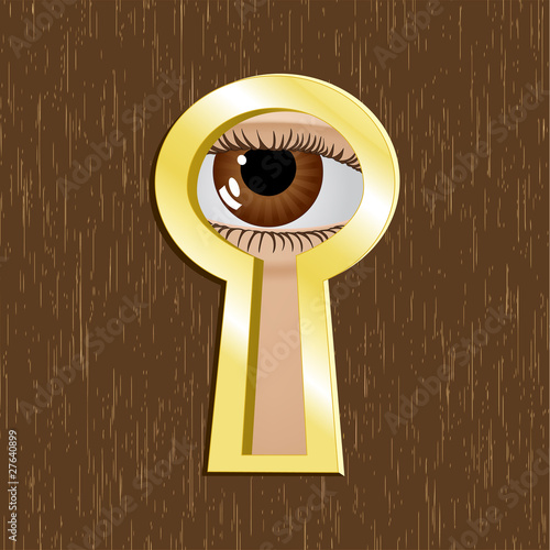 Door keyhole of golden metal with eye