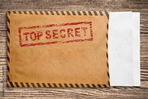 Envelope with top secret stamp and blank papers.