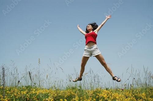 Beautiful young woman jumping