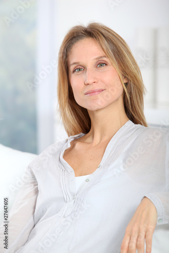 Closeup of beautiful blond woman relaxing at home