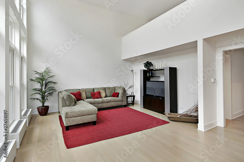 Luxury family room with two story windows