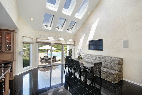 Sitting area with skylights and pool view photo