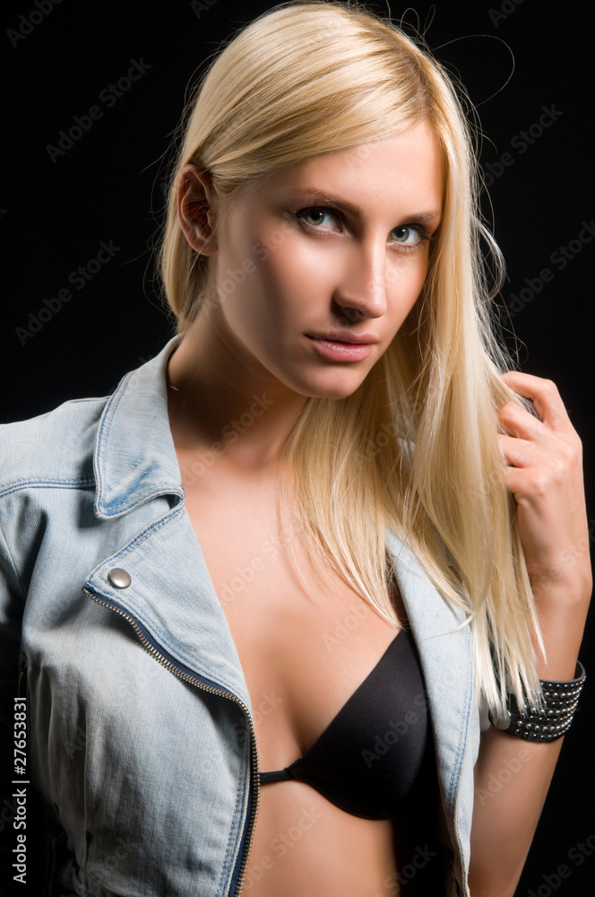 Naklejka premium young woman on a black background