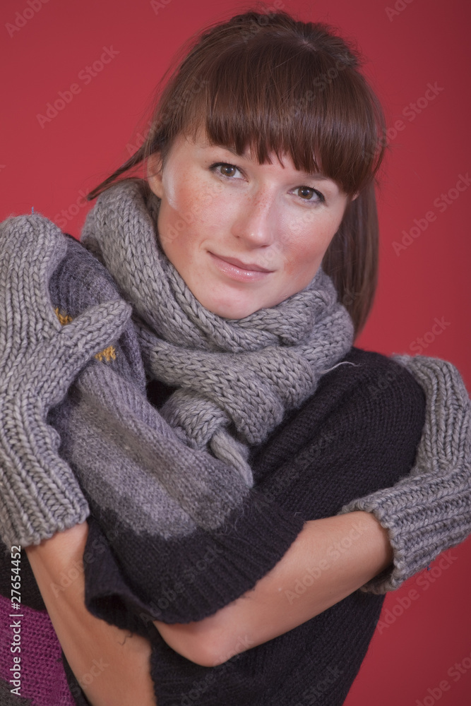 woman in winter scarf and gloves