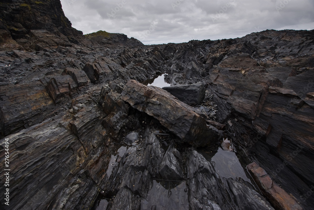 Fototapeta premium Shale rocks on the Arctic Coast at Cape Kekursky, Russia