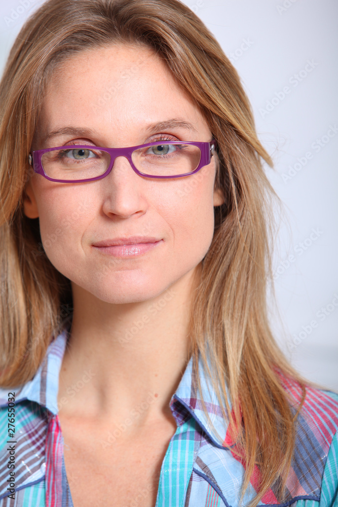 Closeup of beautiful blond woman wearing eyeglasses Closeup of beautiful blond woman wearing eyeglasses