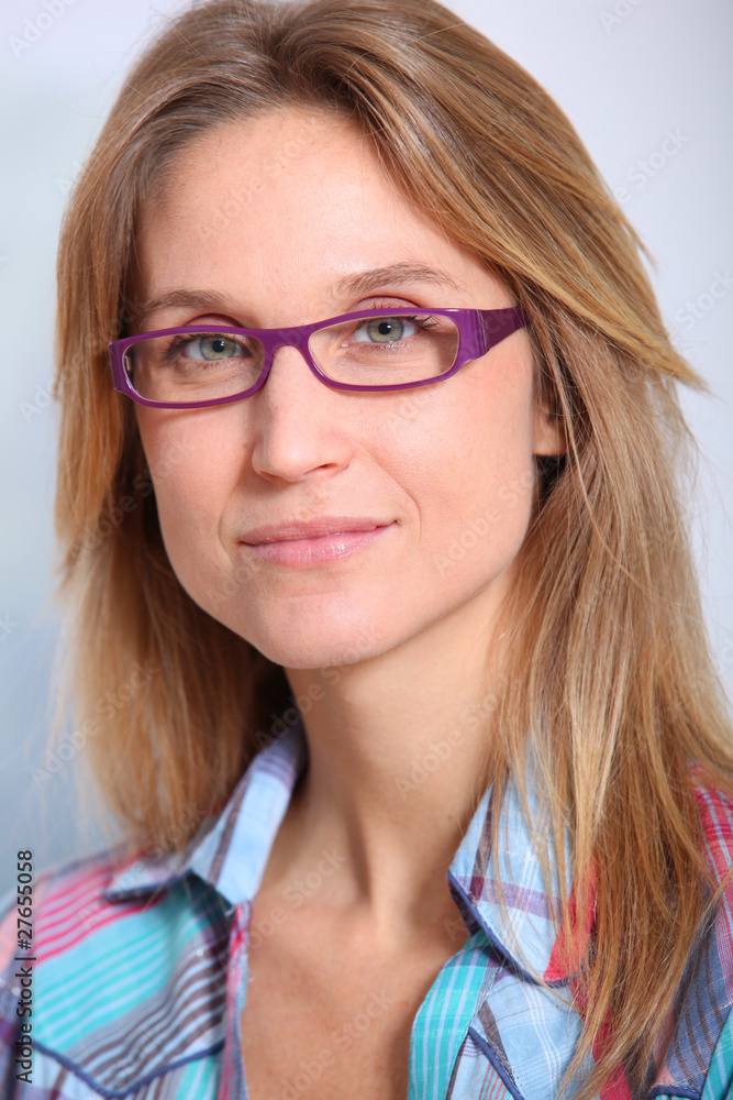 Closeup of beautiful blond woman wearing eyeglasses Closeup of beautiful blond woman wearing eyeglasses