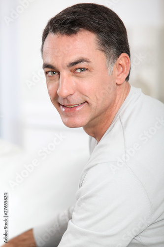 Closeup of handsome man relaxing in sofa