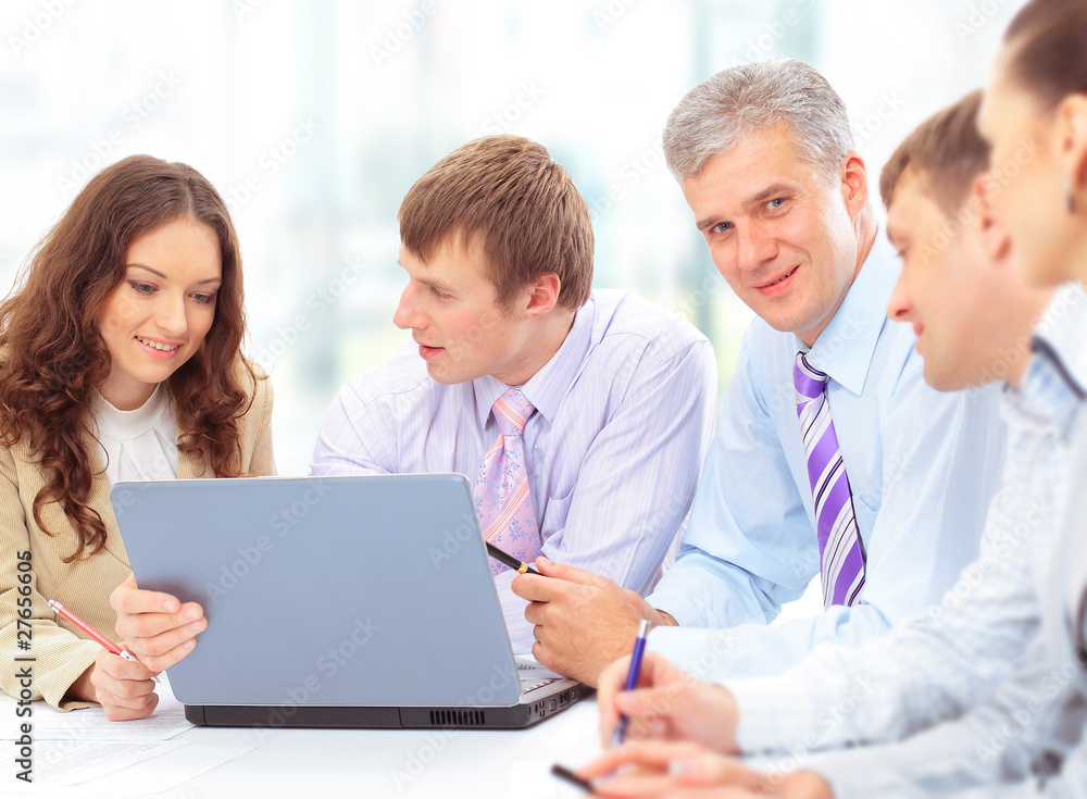Group of happy business people in a meeting at office Group of happy business people in a meeting at office
