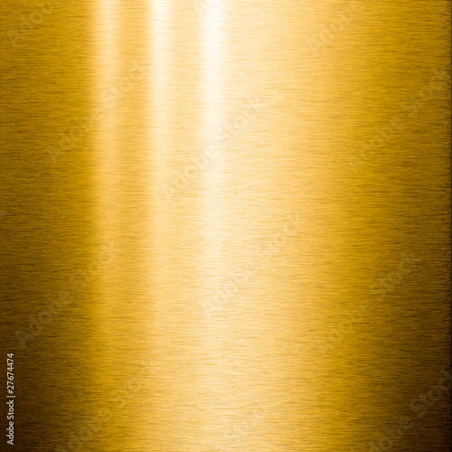 Brushed gold metal plate with reflections