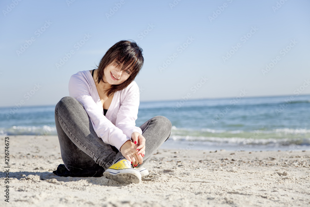 Portrait of brunette girl at the beach. Portrait of brunette girl at the beach.