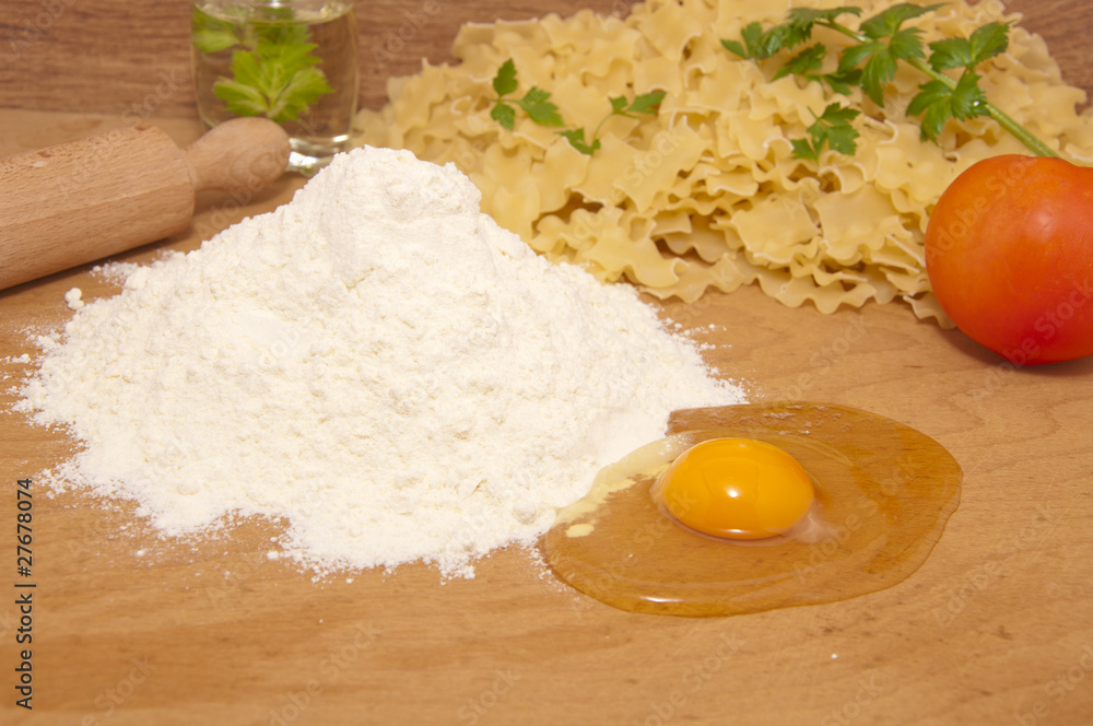 nice fresh pasta ingredients on a board to knead dough nice fresh pasta ingredients on a board to knead dough