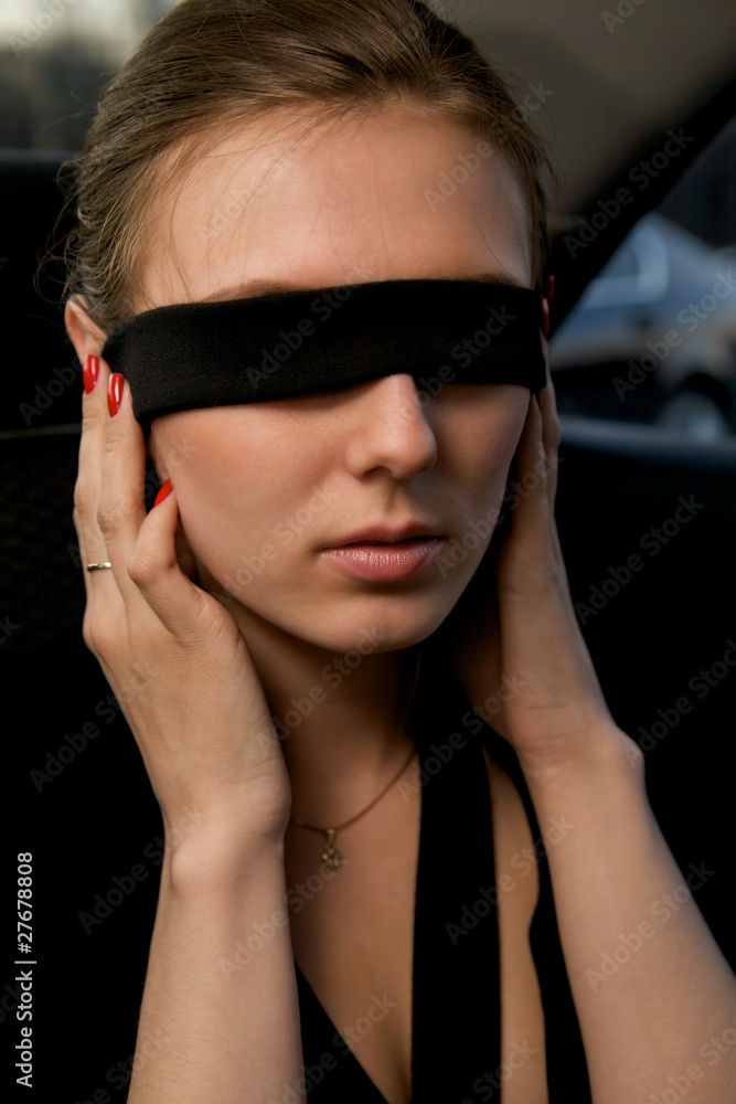 Portrait of a beautiful woman with bandage on eyes Portrait of a beautiful woman with bandage on eyes