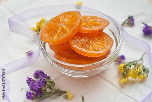Caramelized orange slices in a glass bowl