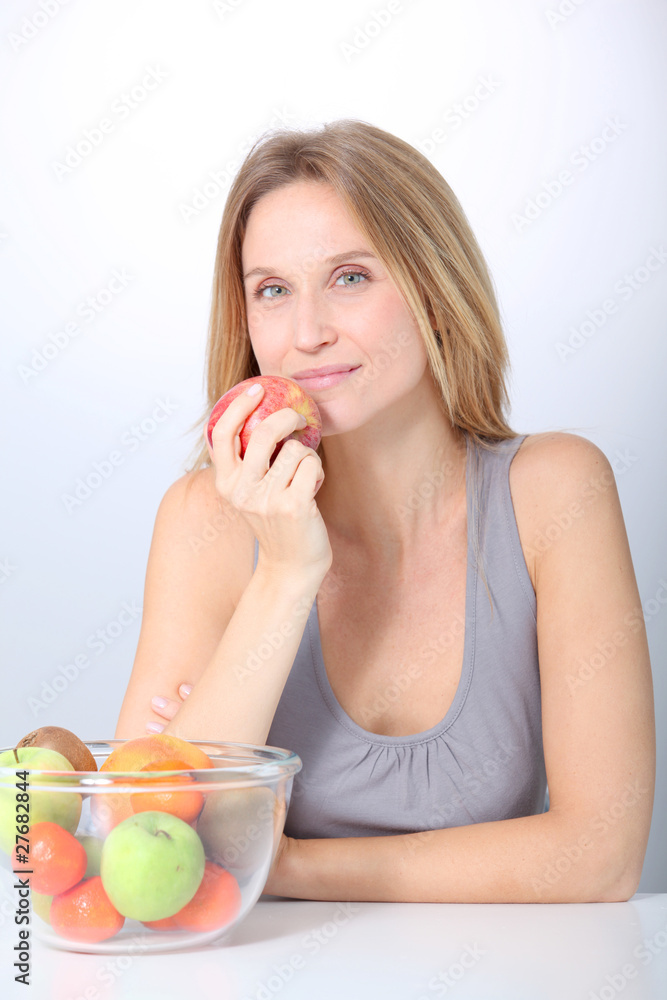 Closeup of beautiful woman holding red apple Closeup of beautiful woman holding red apple