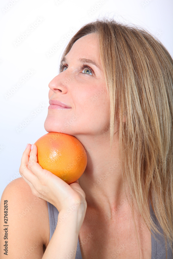 Beautiful woman holding grapefruit Beautiful woman holding grapefruit