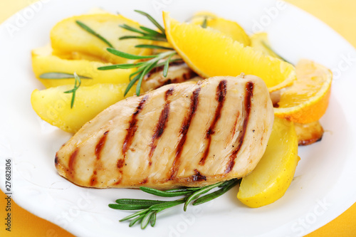 Chicken with fresh rosemary and baked apples with orange juice a
