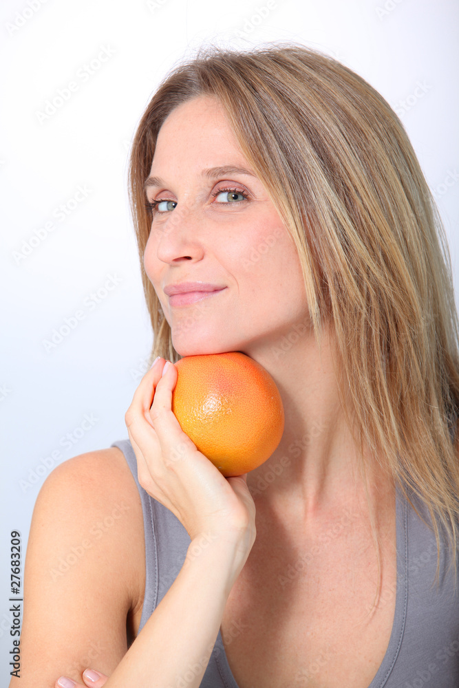 Beautiful woman holding grapefruit Beautiful woman holding grapefruit