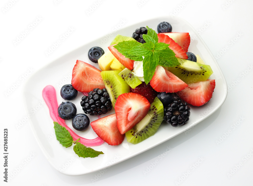fruit salad in a white dish