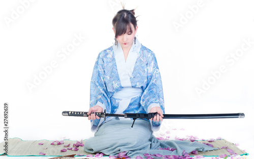 submissive geisha in blue kimono with katana