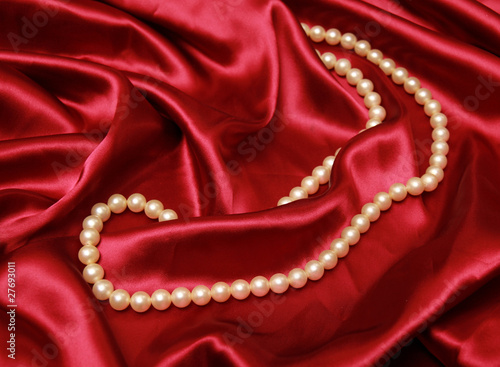 Pearl necklace on a luxury satin